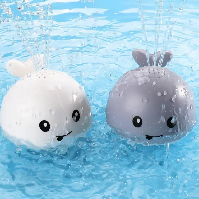 jouet baignoire bebe dauphin arroseur - gris et blanc dans la piscine
